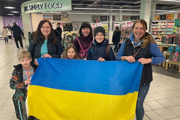 Farnham welcomed its first Ukrainian refugee family this week as (pictured from left to right) Mark, Olha, Yuliia, Olha and Michael were picked up from Luton airport by Oksana (far right) and her husband Tony, from Hale.