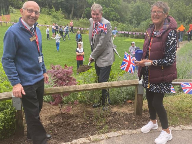 Cllr Simon Dear (centre) planted a commemorative tree for the Jubilee