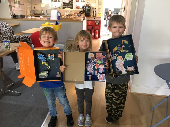 Children created underwater worlds using shoe boxes and fishy cut outs