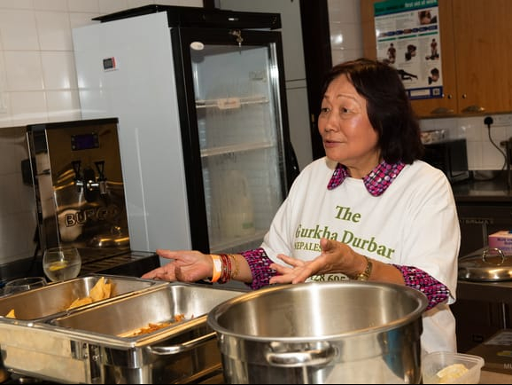 Sudha Rai of the Gurkha Durbar serving delicious curry