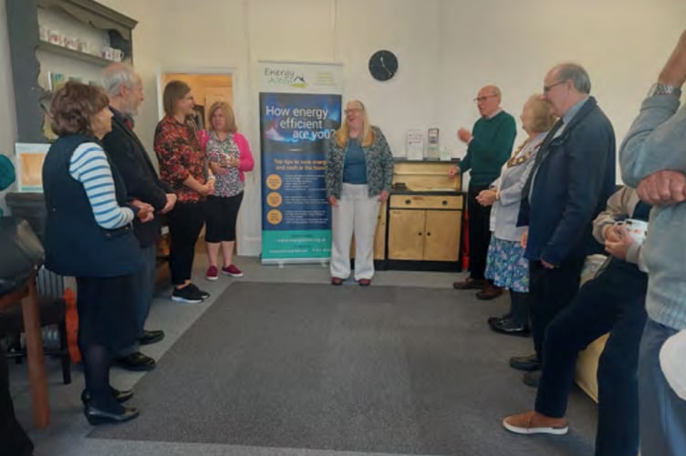 Phinna Brealey, Ginny Boxall and John Hubbard welcome visitors to the official launch of the Alton Energy Advice Café, 16 Market Square, Alton, September 28th 2022.