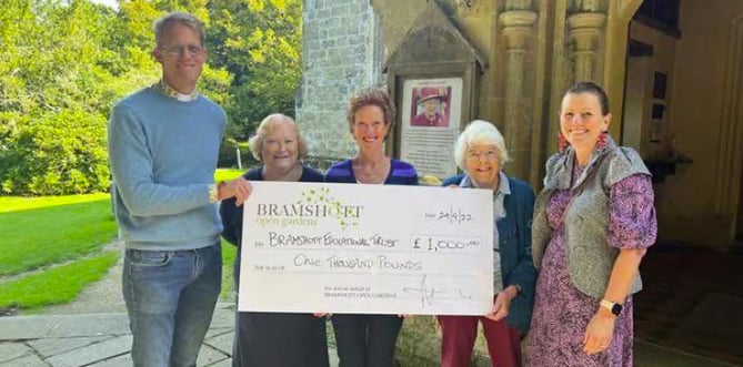 Bramshott Open Gardens presents a cheque for £1,000 to the Bramshott Educational Trust, October 2022.