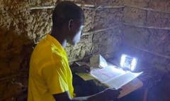 Volunteer from Liphook helps Kenyan children do their homework