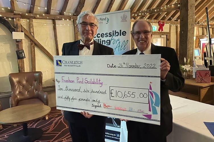Simon Crowther and Ivor Barrett receiving the cheque