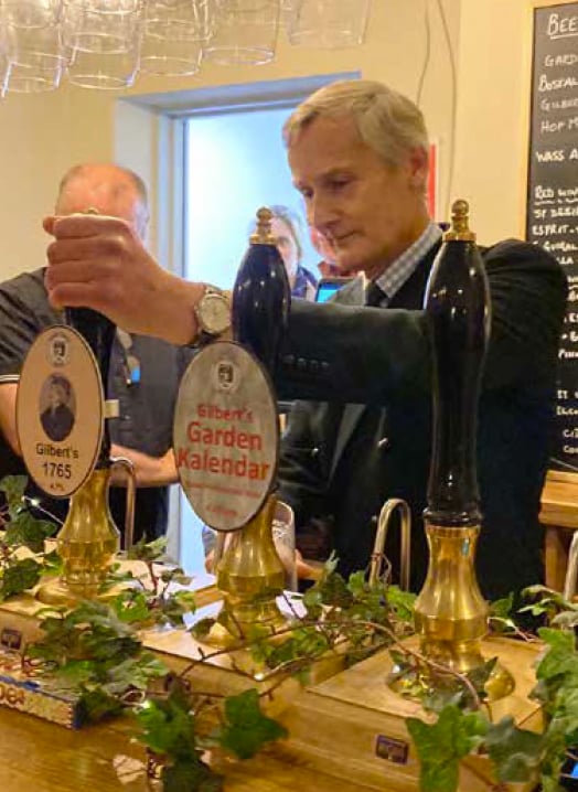 Nigel Atkinson, Lord Lieutenant of Hampshire, pulls the first pint at The Jubilee Tap, Selborne, January 5th 2023.