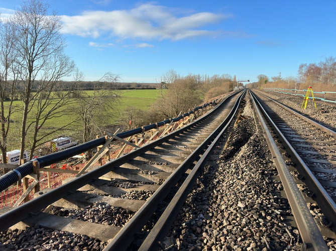 The landslip, on an embankment to the northeast of Hook station, has left only two tracks of the four-track railway passable by trains