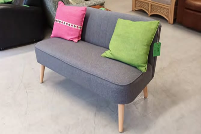 Sofa and cushions at Resurrection Furniture, Alton High Street, January 2023.