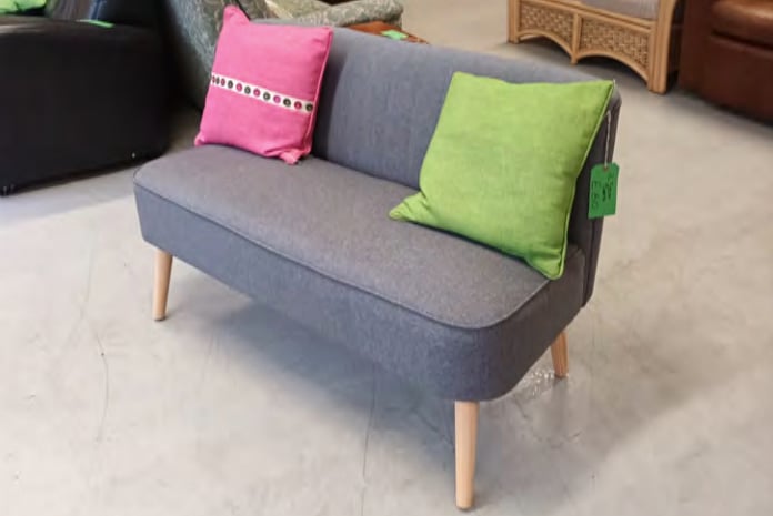 Sofa and cushions at Resurrection Furniture, Alton High Street, January 2023.