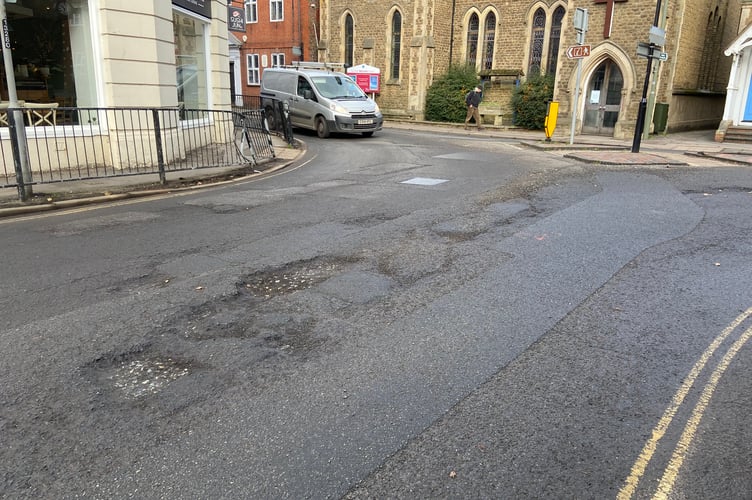 The road surface at the junction of South Street and Union Road is breaking up after the recent cold snap. This photo was taken on Tuesday (January 31) afternoon, when the sub-layer of the road was clearly visible and gravel was strewn across the highway. The Herald has shared these images with Surrey County Council.