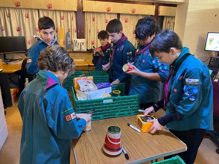 A group from 8th Farnham Scouts helped out at Farnham Food Bank last week