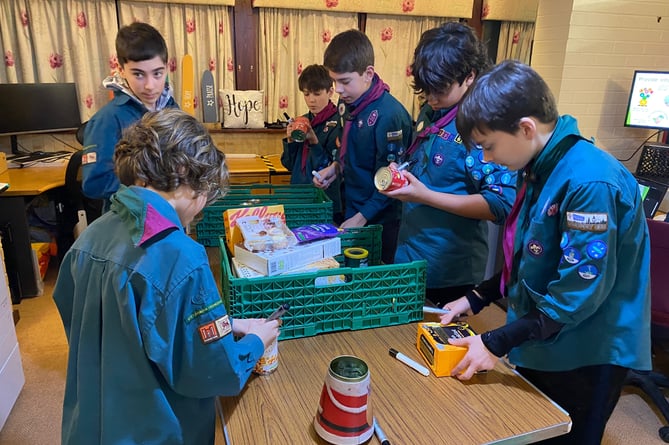 A group from 8th Farnham Scouts helped out at Farnham Food Bank last week