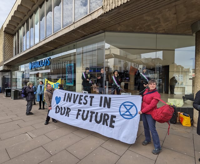 Extinction Rebellion ‘suffragettes’ chain themselves in Guildford bank