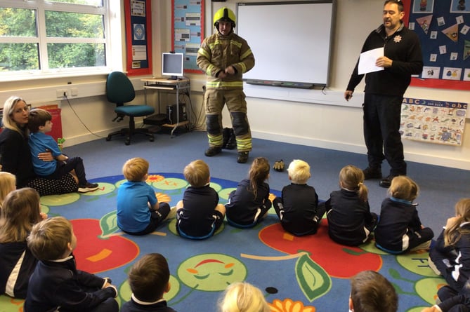 Children at St Ives school with Surrey Fire and Rescue Service staff