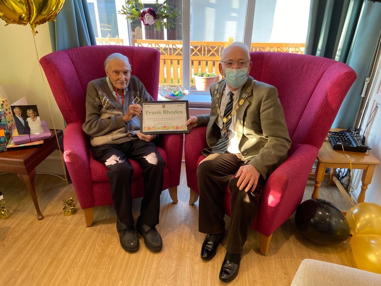 Frank Rhodes receives his certificate from the mayor of Farnham on his 100th birthday