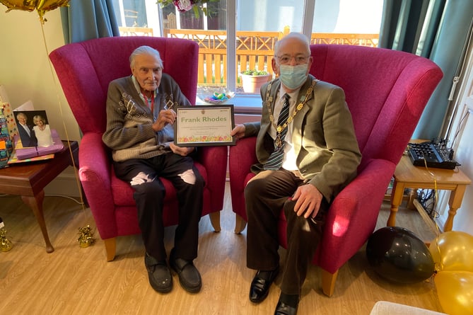 Frank Rhodes receives his certificate from the mayor of Farnham on his 100th birthday