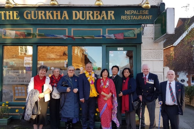 Mani and Sudha with staff and just some of The Gurkha Durbar’s many loyal customers outside the restaurant