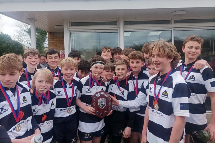 Farnham under-13s pose proudly with the trophy
