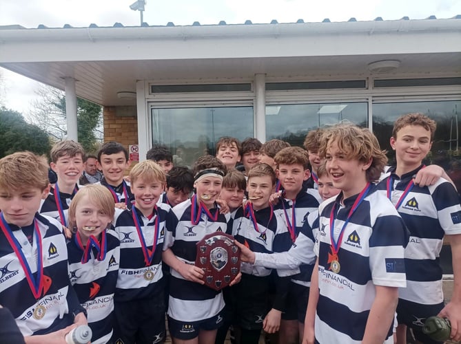 Farnham under-13s pose proudly with the trophy