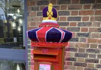 Knitted crown for Petersfield post box to celebrate coronation