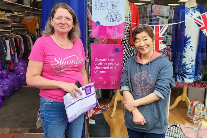 Macala Cooper, left, and Miyako Kamamoto outside the Alton Cancer Research UK shop, May 1st 2023.