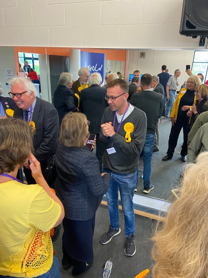 Lib Dem candidate for Chiddingfold, Dave Busby, is congratulated on his election win by fellow Lib Dem Liz Townsend