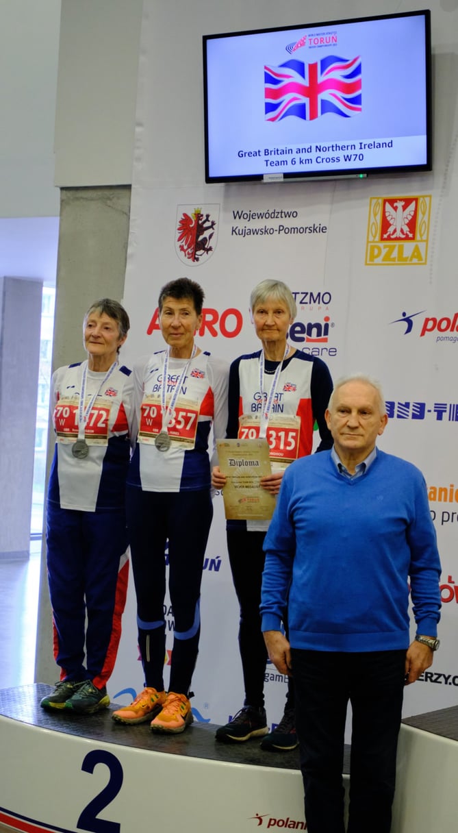 Farnham Runners member Jane Georghiou (second right) won a silver team medal in Torun, Poland