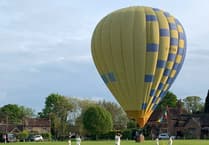 Video: Hot air balloon stops play for Chiddingfold under-tens and Blackheath