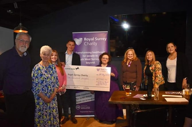 Judith Storey of the Friends of Royal Surrey hands over the cheque to MP Jeremy Hunt for the Royal Surrey cancer and surgical innovation centre campaign