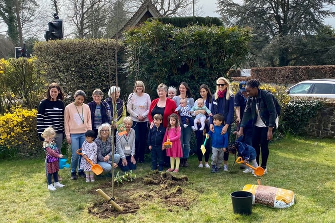 Members of the St Stephen’s Shottermill congregation planting a tree as part of the Queen’s Green Canopy project
