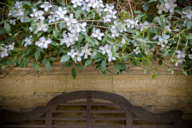 Inscription under flowering clematis in the North Courtyard of Munstead Wood