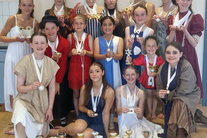 The Haslemere Performing Arts Festival team with their impressive haul of medals