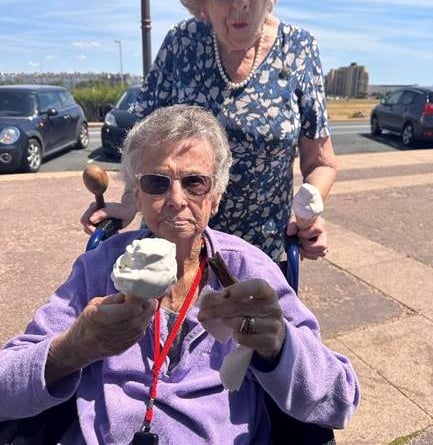 Residents Joan and Jenny enjoy their ice-creams to keep the heat at bay