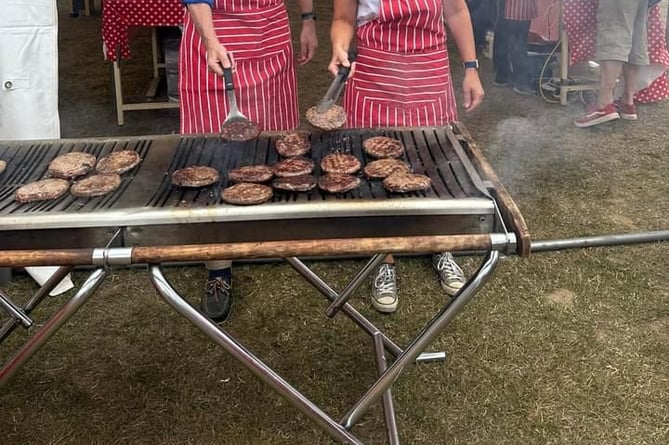 Chancellor Jeremy Hunt flips the burgers at Hale Carnival 2023