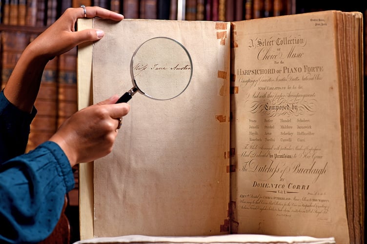 Pictured: Clio O'Sullivan studies the music book with a magnifying glass while in the library of Chawton House, displaying Jane Austen's signature on the inside page.
Jane Austen's Music book has been discovered after it was missing for 40 years
© Simon Czapp/Solent News & Photo Agency
UK +44 (0) 2380 458800
