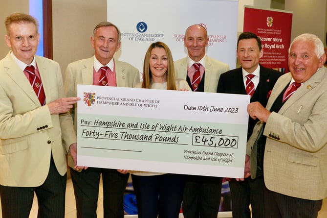 The Provincial Grand Chapter of Hampshire and Isle of Wight Freemasons donate £45,000 to the Hampshire and Isle of Wight Air Ambulance charity, June 2023. From left: Steve Allum, Chris Davis, Jill McDonagh, Jonathan Stainton-Ellis, Jonathan Bell and Dave Wood.