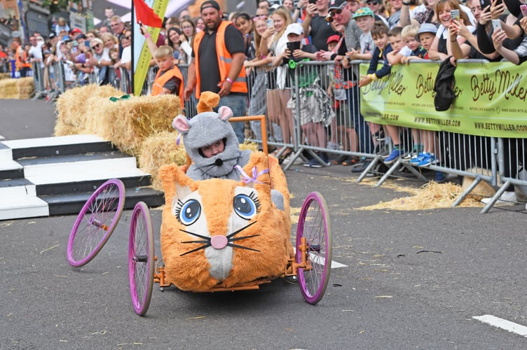 BORDON SOAPBOX
BORDON, HAMPSHIRE
ENGLAND
23rd JULY 2023
On Sunday 23rd July 2023 Whitehill & Bordon in Hampshire was transformed into the ultimate community driven soapbox spectacle, the official Bordon Soapbox Derby
With the main road through the town closed to traffic the hundreds of spectators were able to walk around the attractions that had been put in place in the early hours of Sunday before gathering many deep on Chalet Hill to watch the 'soapbox racers' take on the challenge to be the fastest competitor to get to the Finish Line !
Some of the racers were quick, some were slow, and some driver's after having spectacular spills were permitted to run to the Finish Line as long as they were carrying 'any part of their soapbox' !
(Photo by Malcolm Wells)
Standard reproduction rates apply, contact Malcolm Wells to arrange payment - Mobile: 07802-217-569
malcolmrichardwells@gmail.com
