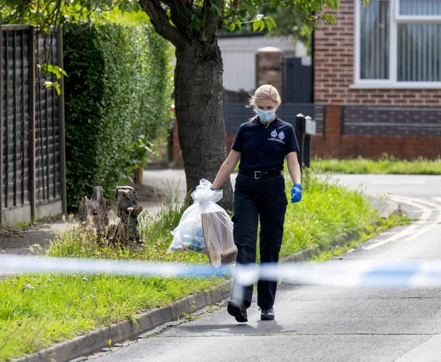Police forensics officers remove evidence from Horsell murder scene