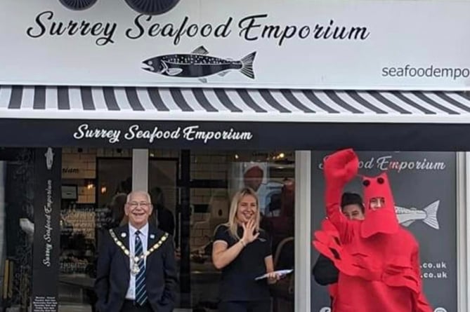 Farnham's mayor Alan Earwaker with a giant lobster at the opening of the Surrey Seafood Emporium in Downing Street