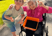 Unlikely friends go berry picking together