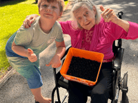 Unlikely friends go berry picking together