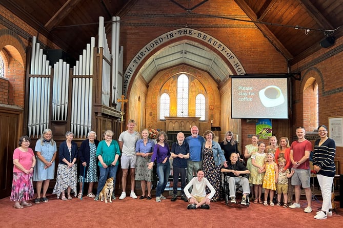 Members of the St Mark's congregation with the church's new carpet