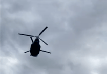 Watch the incredible moment a Chinook flies just metres over Hankley Common golfers