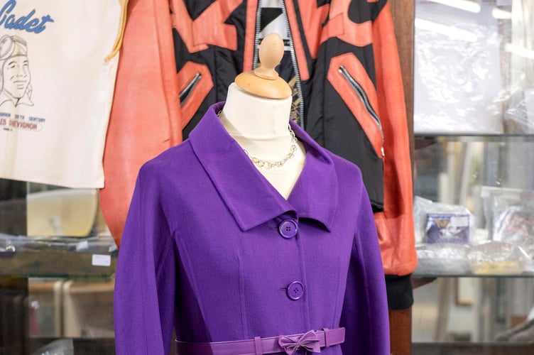 A violet Christian Dior double-faced Italian cashmere coat is expected to fetch £300