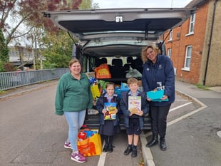 Alton School gives harvest festival donations to Alton food bank 