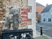 Street artist Hendog creates teddy bear on wall in Petersfield