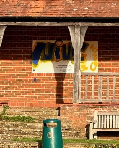 Graffiti on the Chichester Hall sign