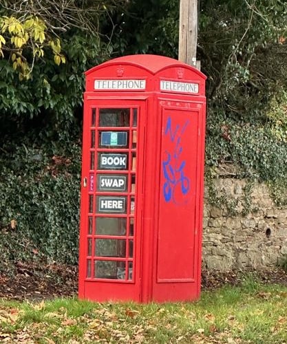 Graffiti on the telephone box on the Petworth Road 