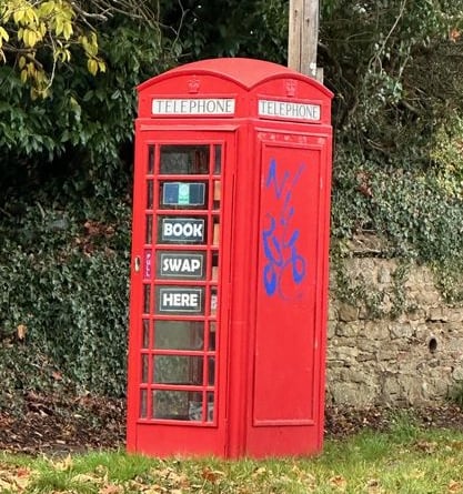 Graffiti on the telephone box on the Petworth Road 