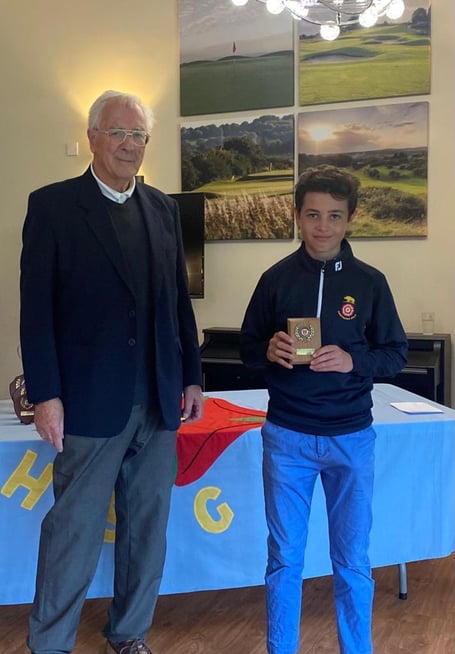 Ollie McDonald receives his prize from Frank Hayward at Hockley Golf Club