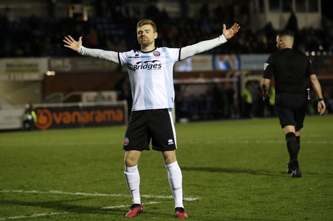 Jack Barham salutes the Shots fans after scoring the decisive penalty